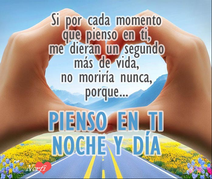 Manos haciendo el simbolo del amor, con carretera de fondo
